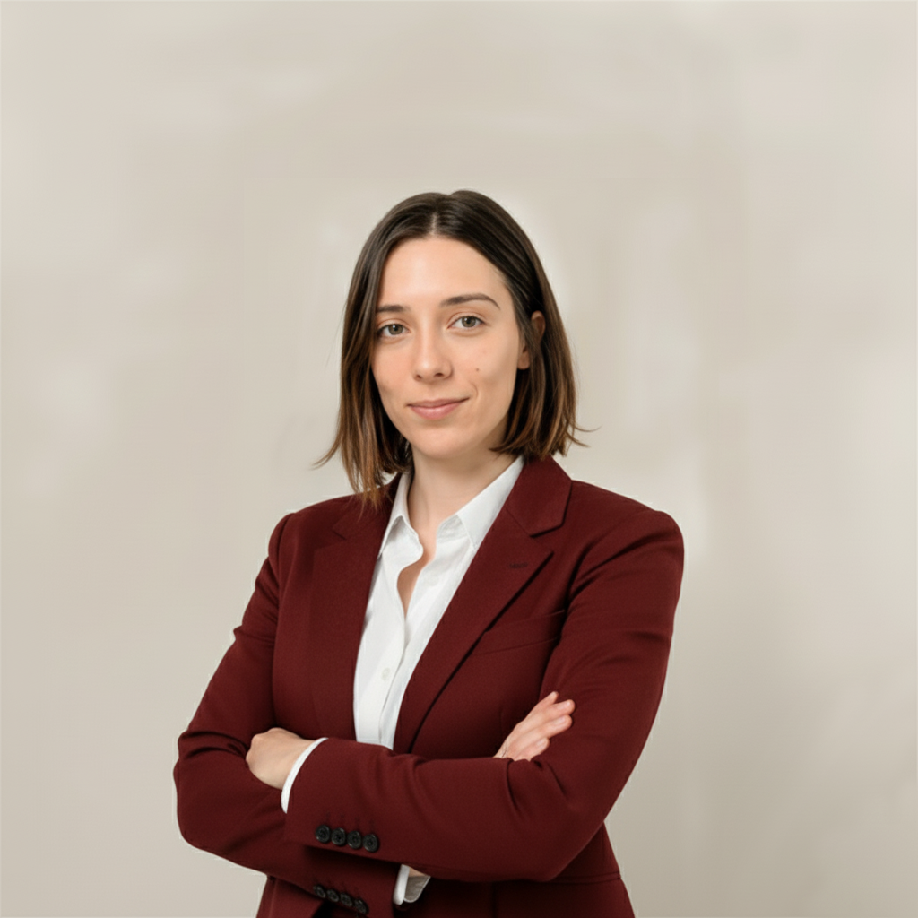 woman standing with crossed arms and looking at the camera